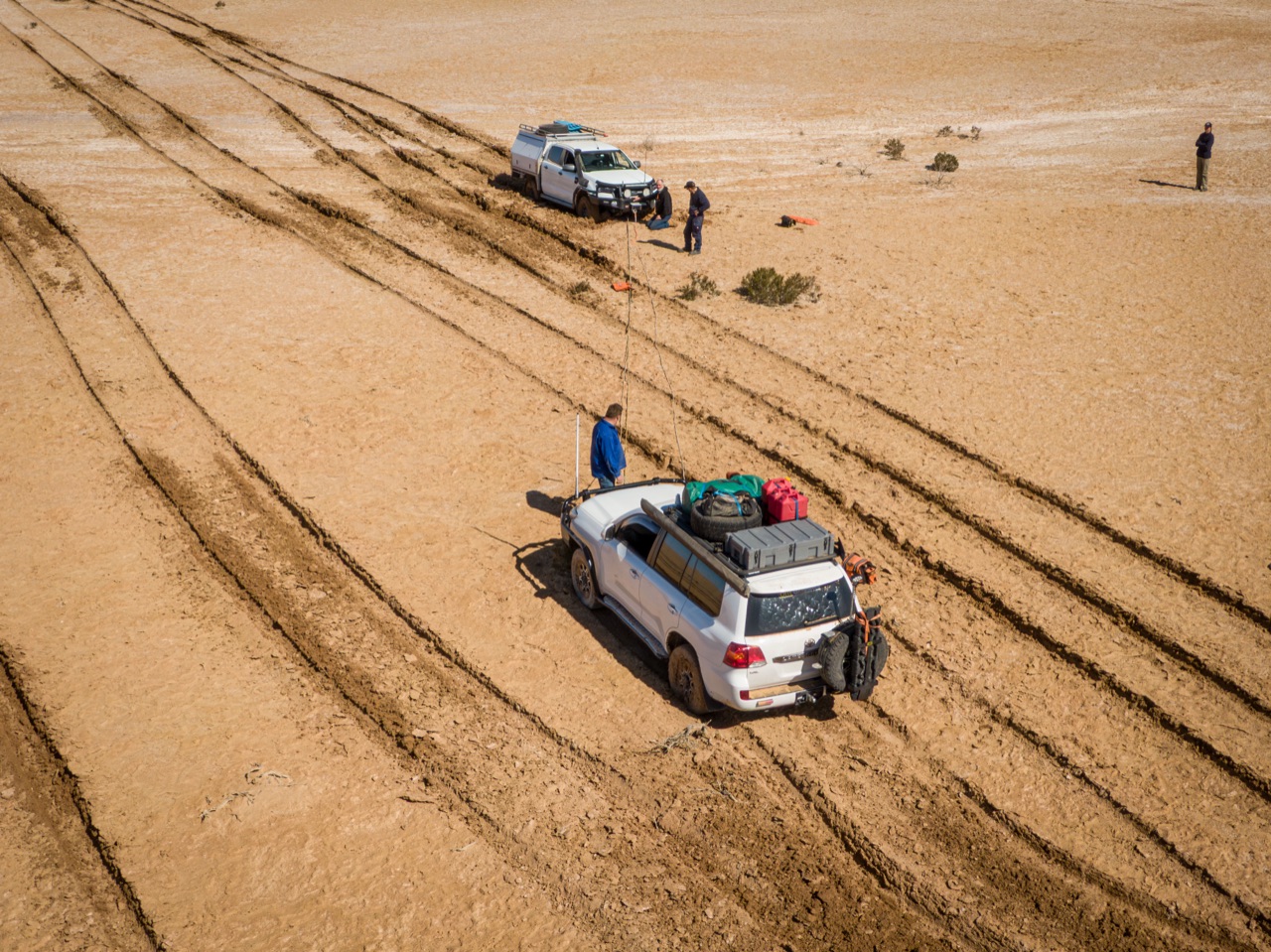 Aerial view of a 4WD vehicle crossing the Simpson Desert red sand dunes
