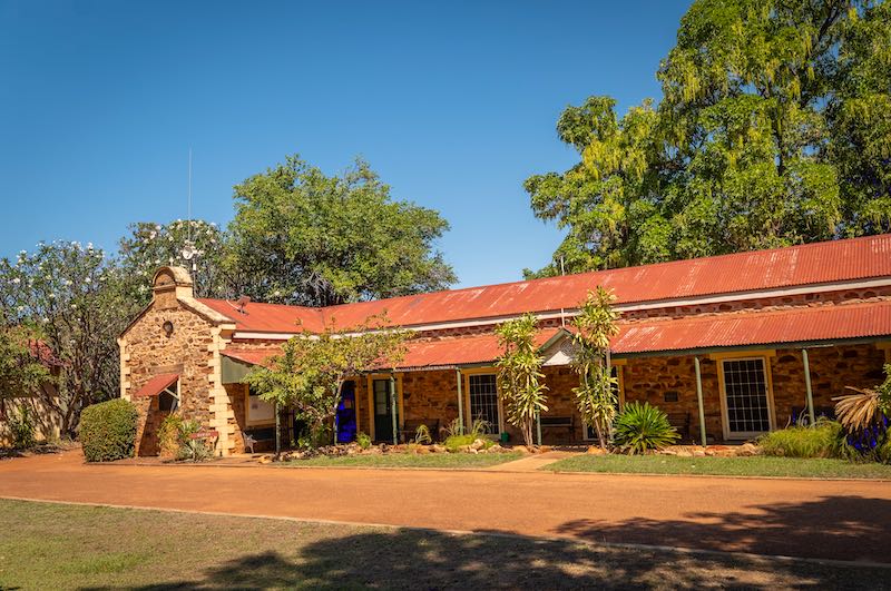 Sandstone mission building at Kalumburu with a red corrugated roof