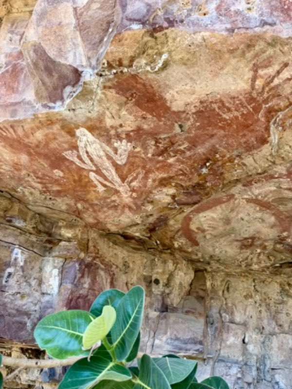 Rock art at Moochalabra, including a white figure and a red hand stencil