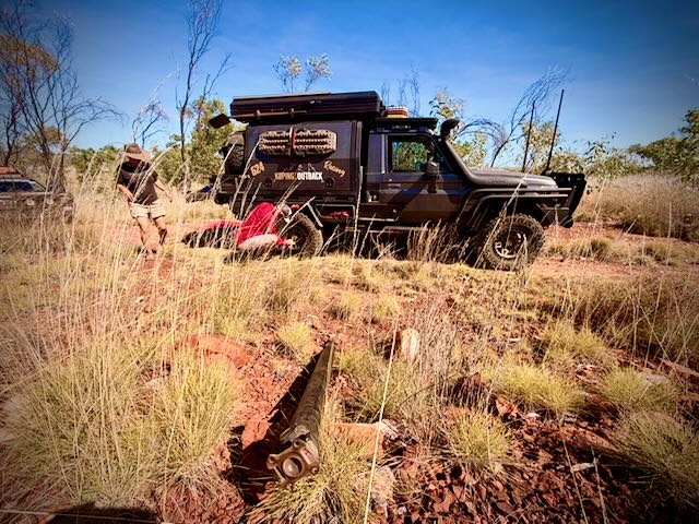 The rocky step on the Oombi Track where Devo broke the rear diff, with a recovery board on the rock